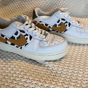 Nike women’s White Sneakers with Tan Swoosh and Black Cow Spot Accents